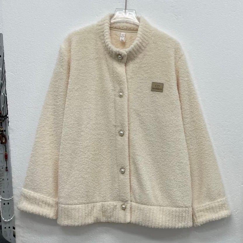 Cream jacket source photo with a small blurred chest label