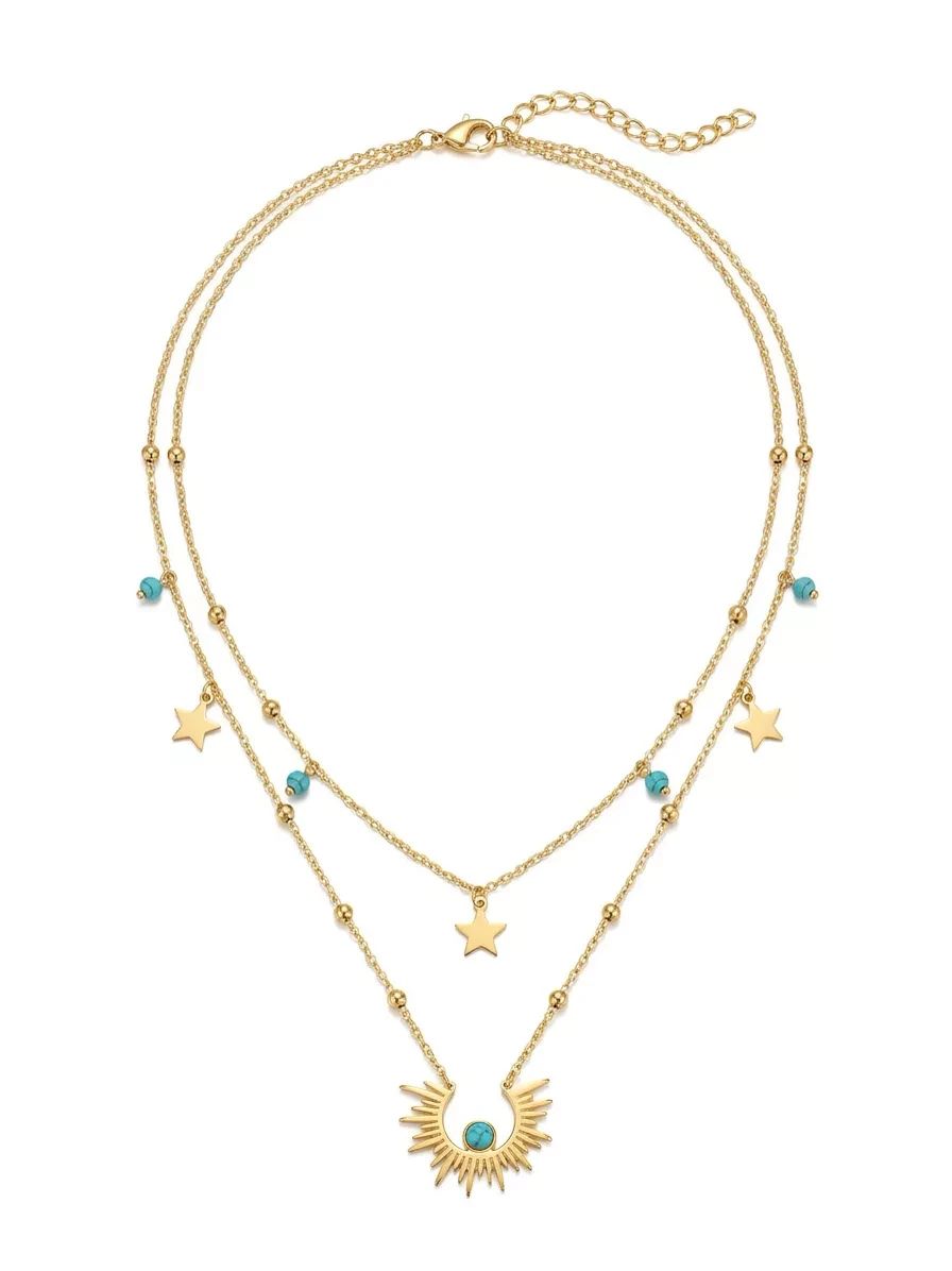 Layered gold necklaces separated and presented on a clean white background