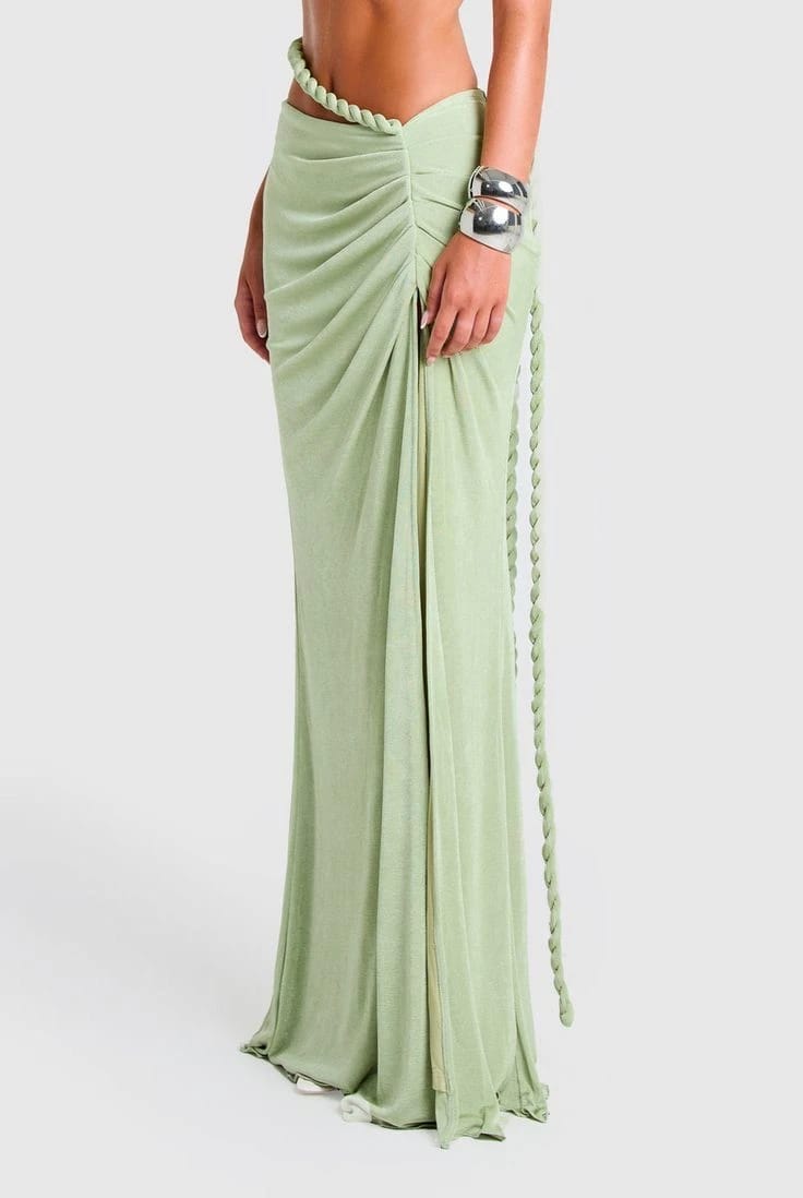 Long pale green draped skirt shown on a model from waist to hem