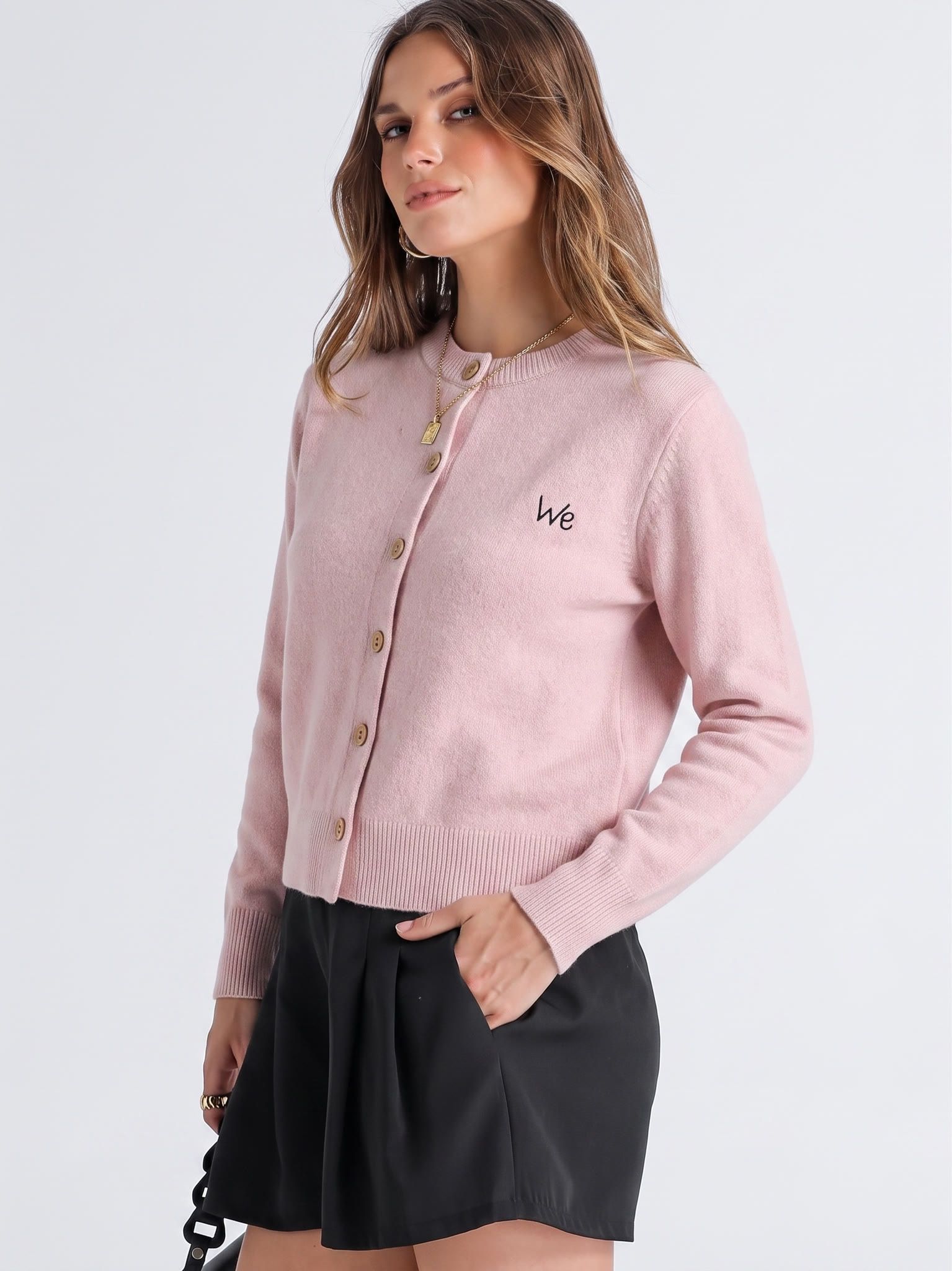 Three-quarter model view of the pink cardigan