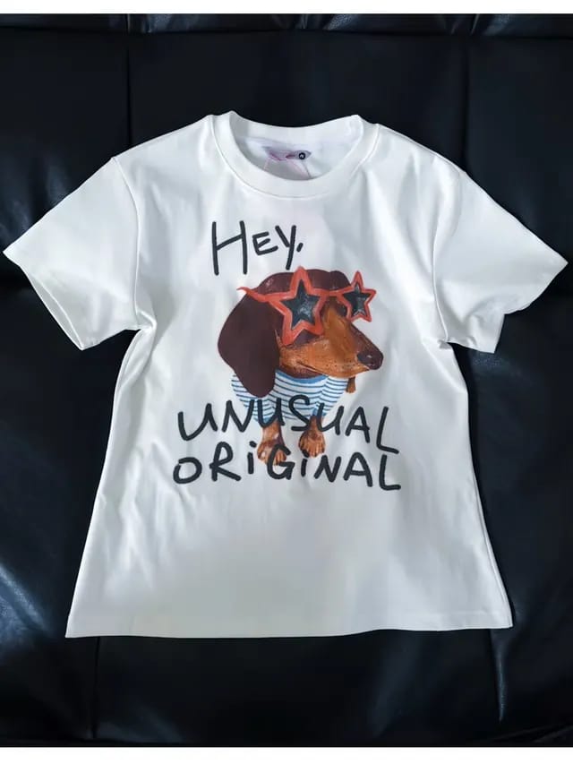 Printed T-shirt source on a black sofa