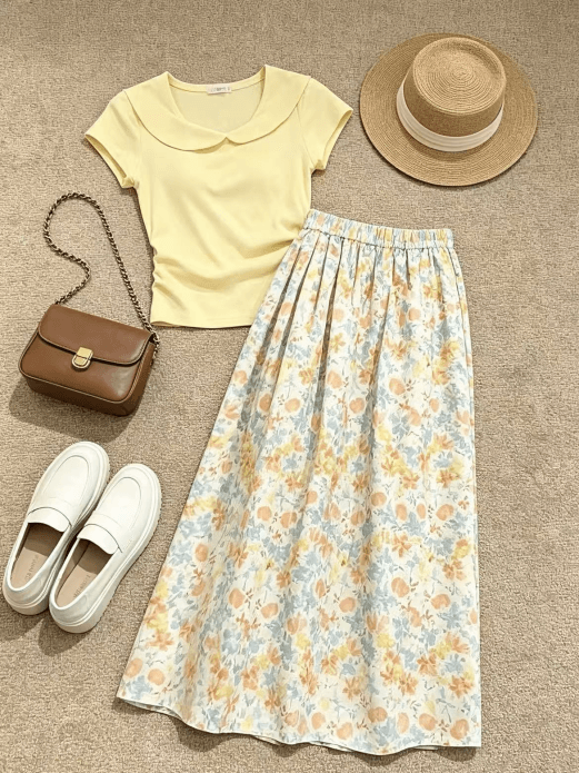 Source flat-lay with a yellow top and floral skirt