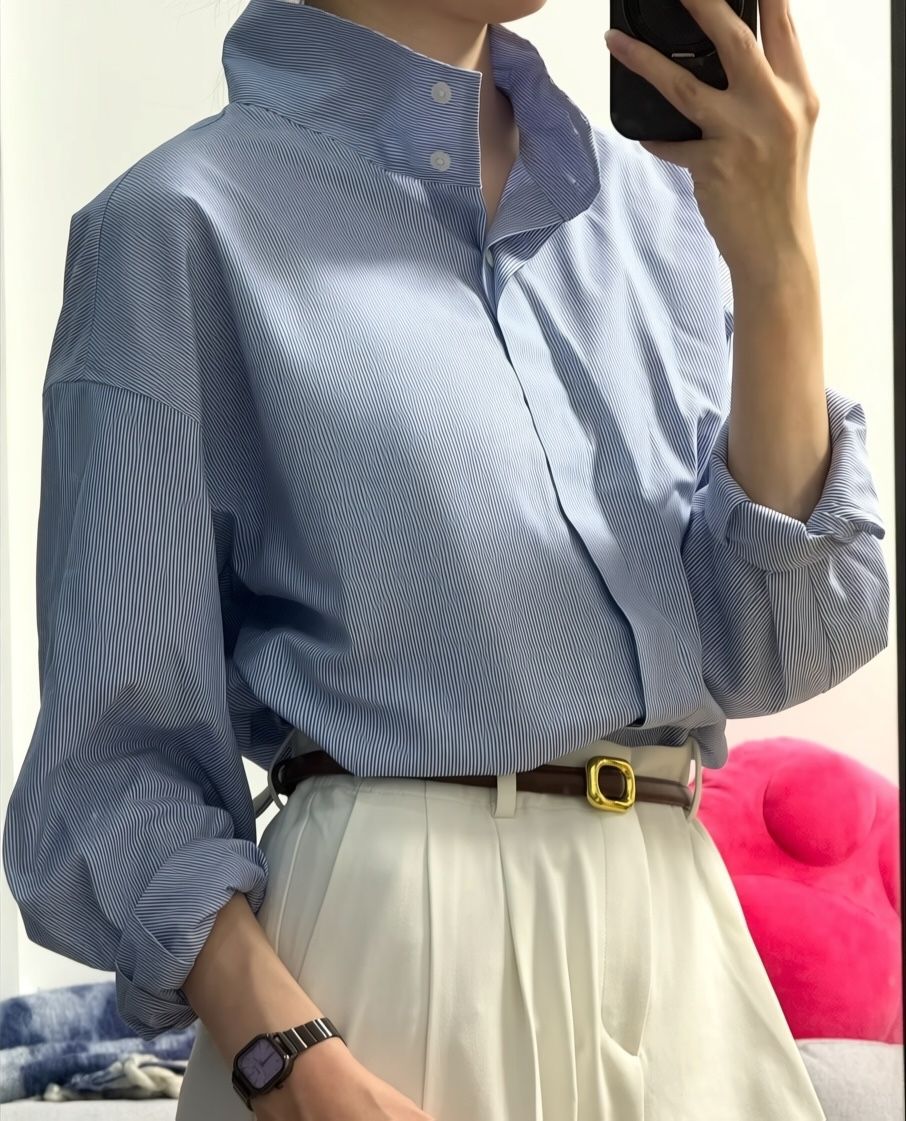 Blue shirt on a person after Photoroom wrinkle removal