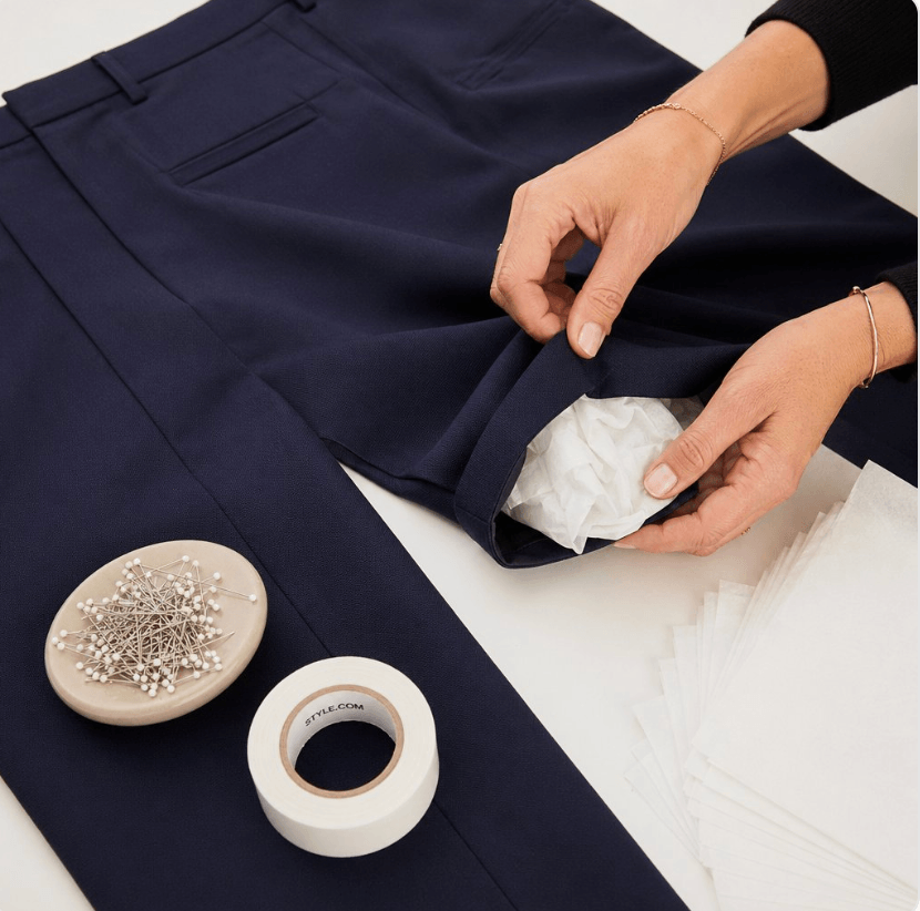 Hidden tissue and pins used to add natural volume beneath a garment