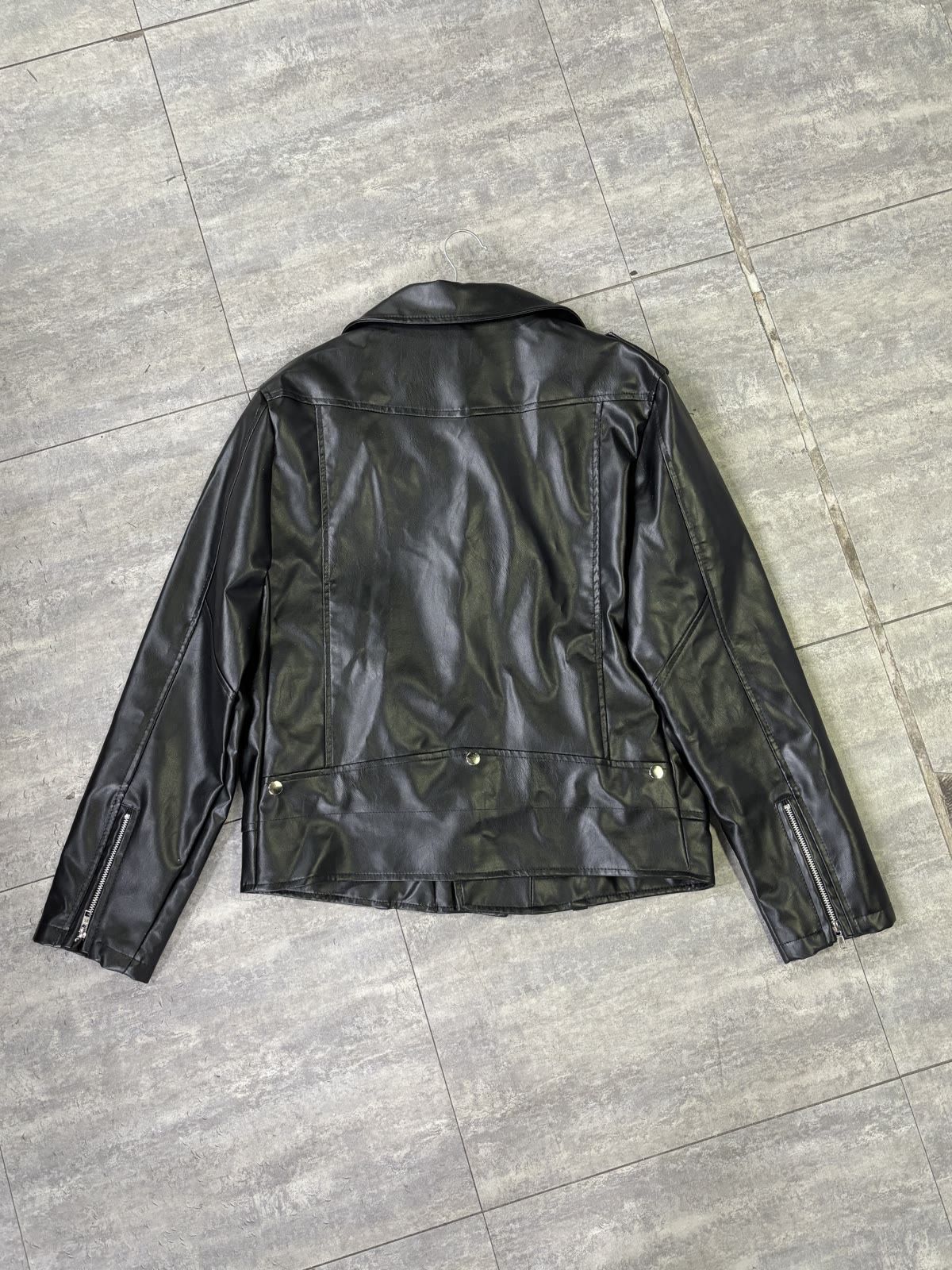 Back view of the leather jacket photographed flat