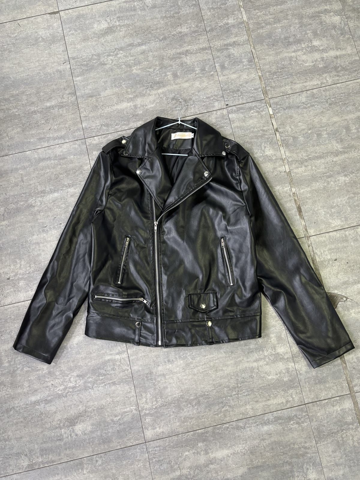 Front view of the leather jacket photographed flat