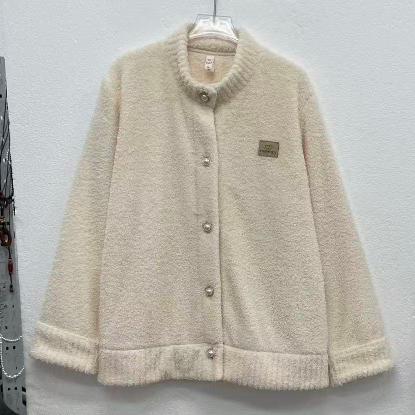 Full front hanger photo of a cream fleece jacket with five buttons and a chest patch