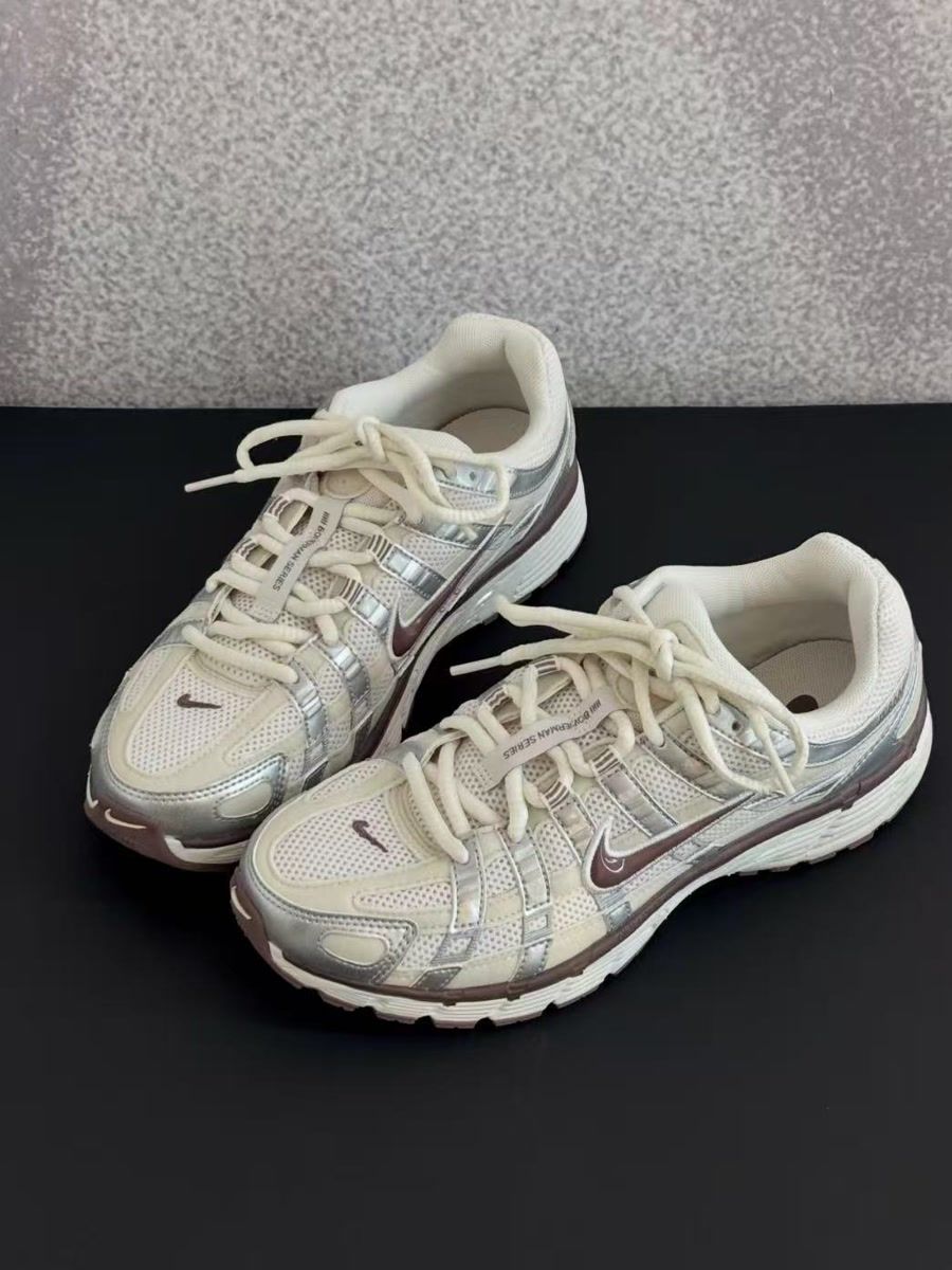 The source photo of the sneakers, shot on a grey and black surface