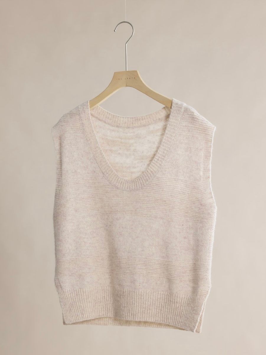 Original hanger photo of a light beige V-neck knit vest