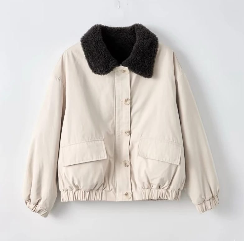 Original photo of a cream padded jacket with a dark fleece collar