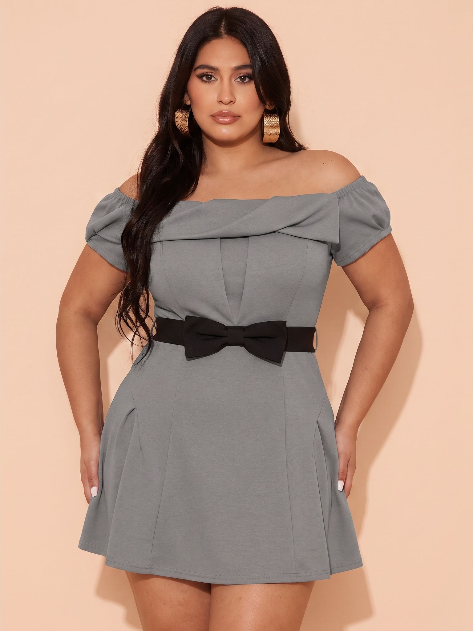 Plus-size model wearing the same gray dress
