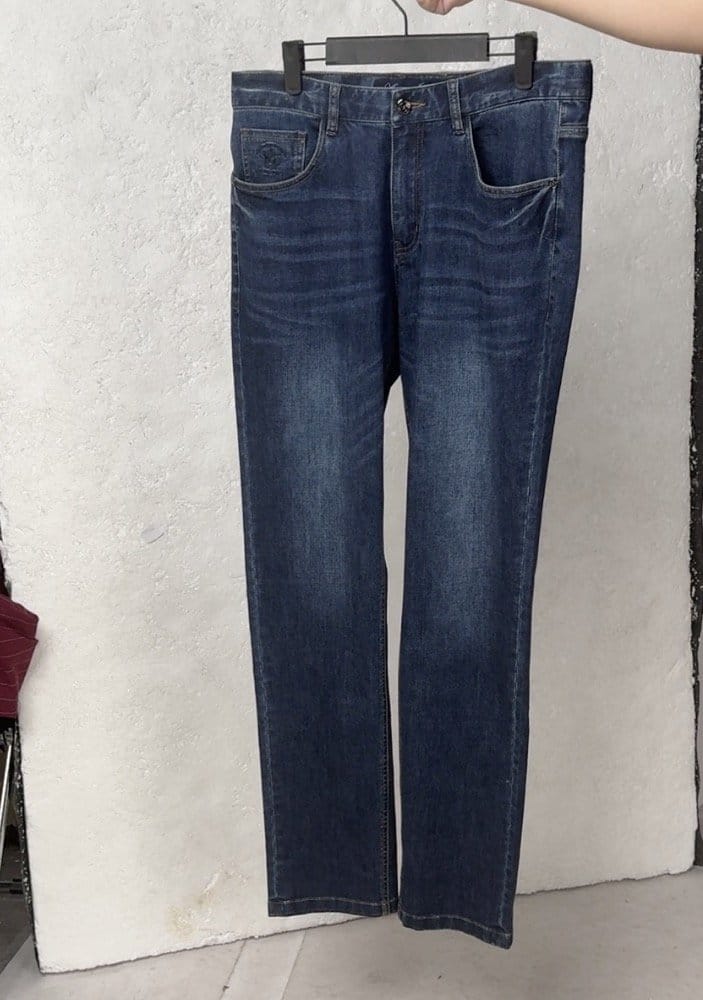 Flared denim jeans shown as a flat-lay product photo