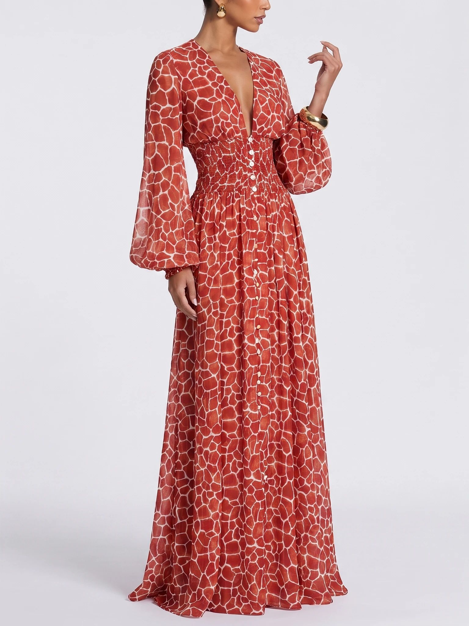 Closer angled model composition showing the red dress neckline, sleeve and gathered waist