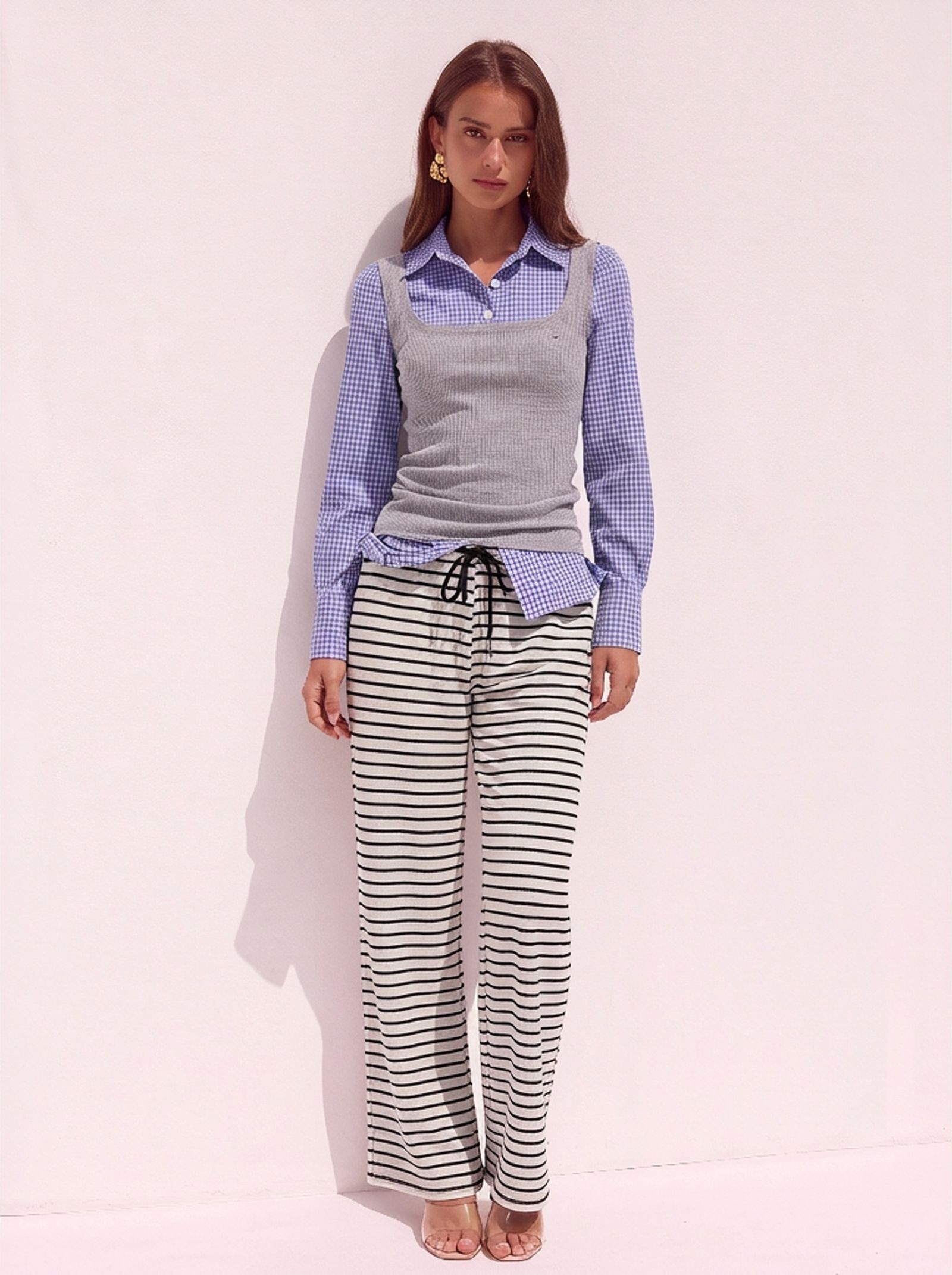 WearView AI model output — the black and white striped wide-leg pants rendered on a generated model