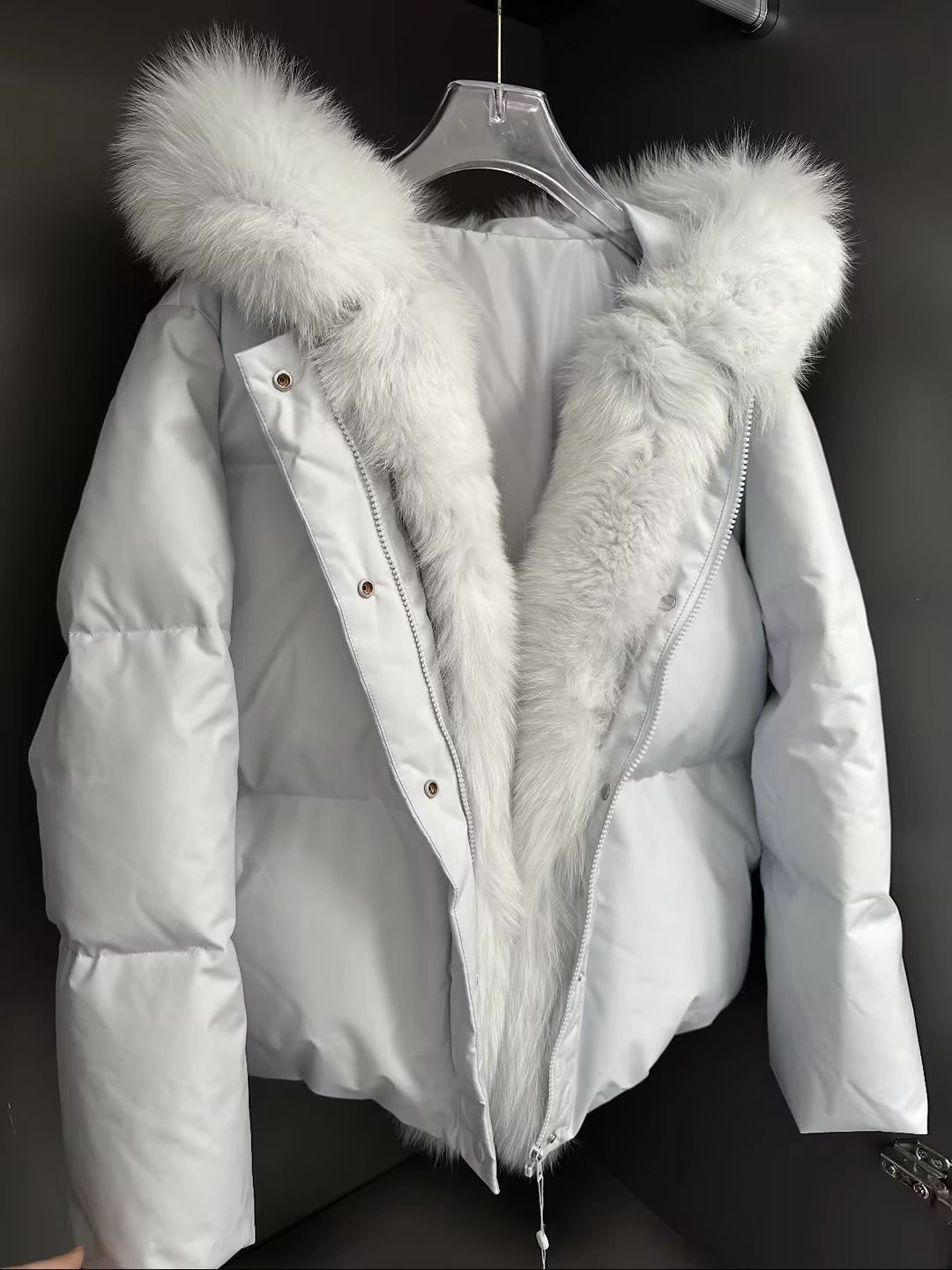 Test input for both AI try-on tools — hanger product photo of a white hooded down jacket with a thick white fur collar, snap placket and full-length zip