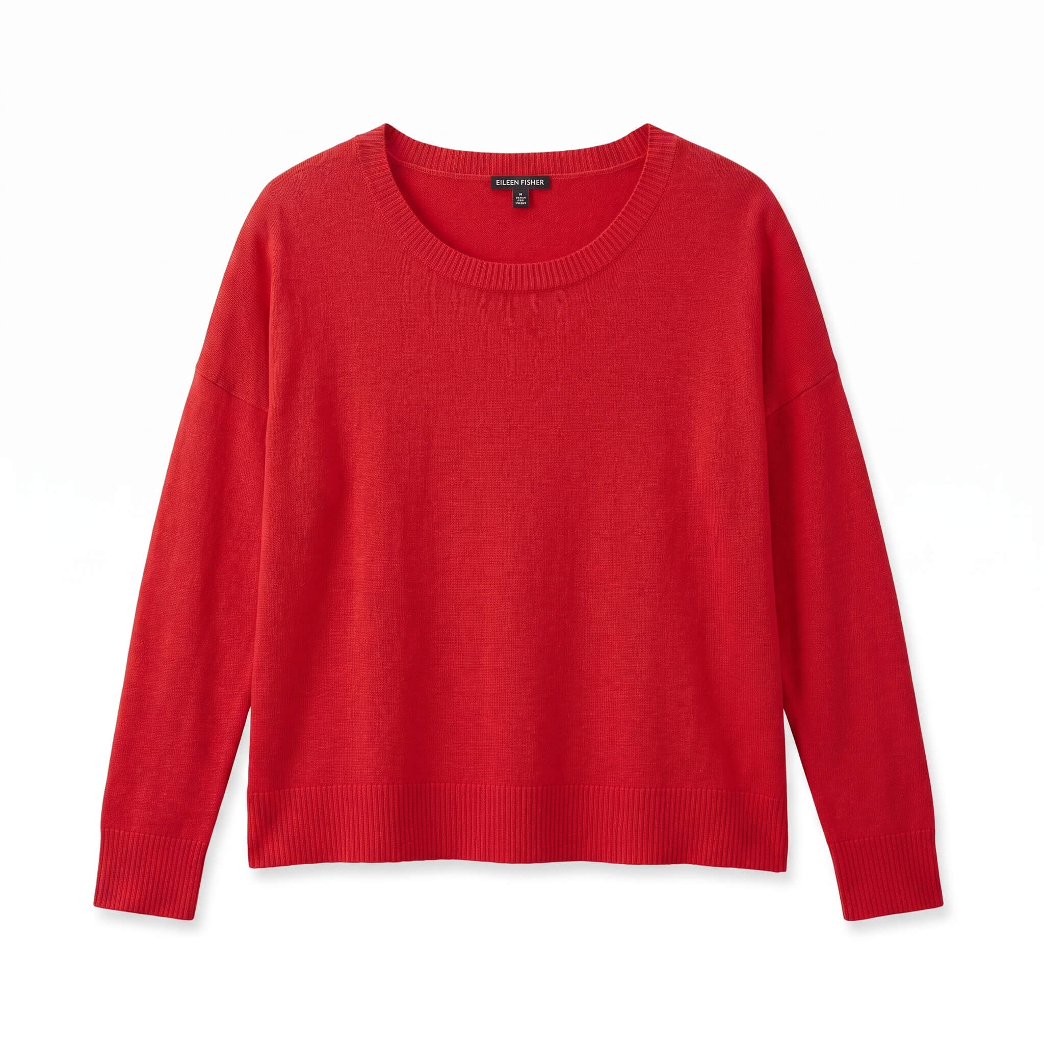 Red sweater laid flat with the neckline and sleeves fully visible
