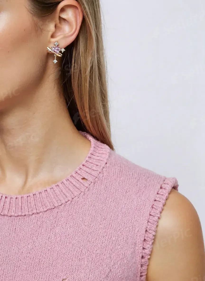 The pink heart stud on an AI-generated model, shot close on the ear