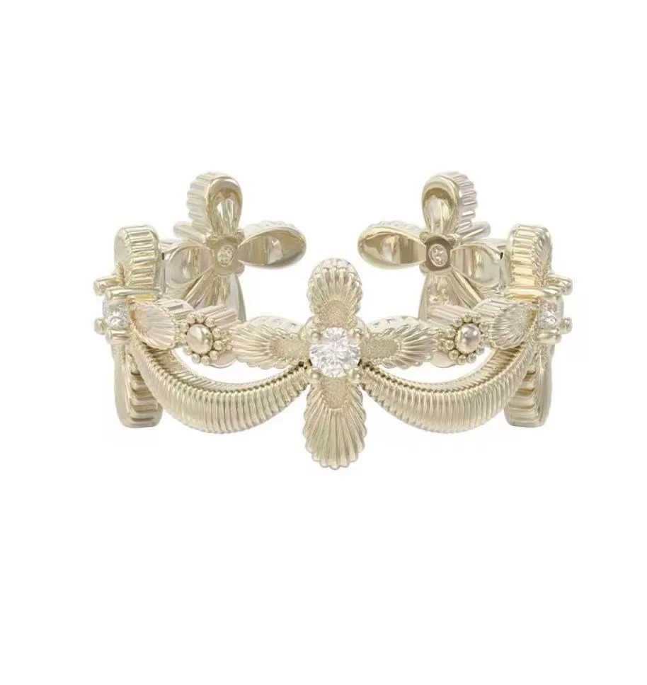 Openwork gold ring with a raised floral band pattern