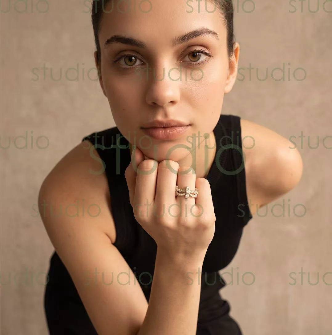 Studio Loya ring output with the model chin resting on a hand