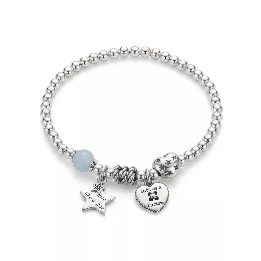 Snappyit Jewelry Retouch output — silver charm bracelet on white background with engraved star and heart charms kept sharp