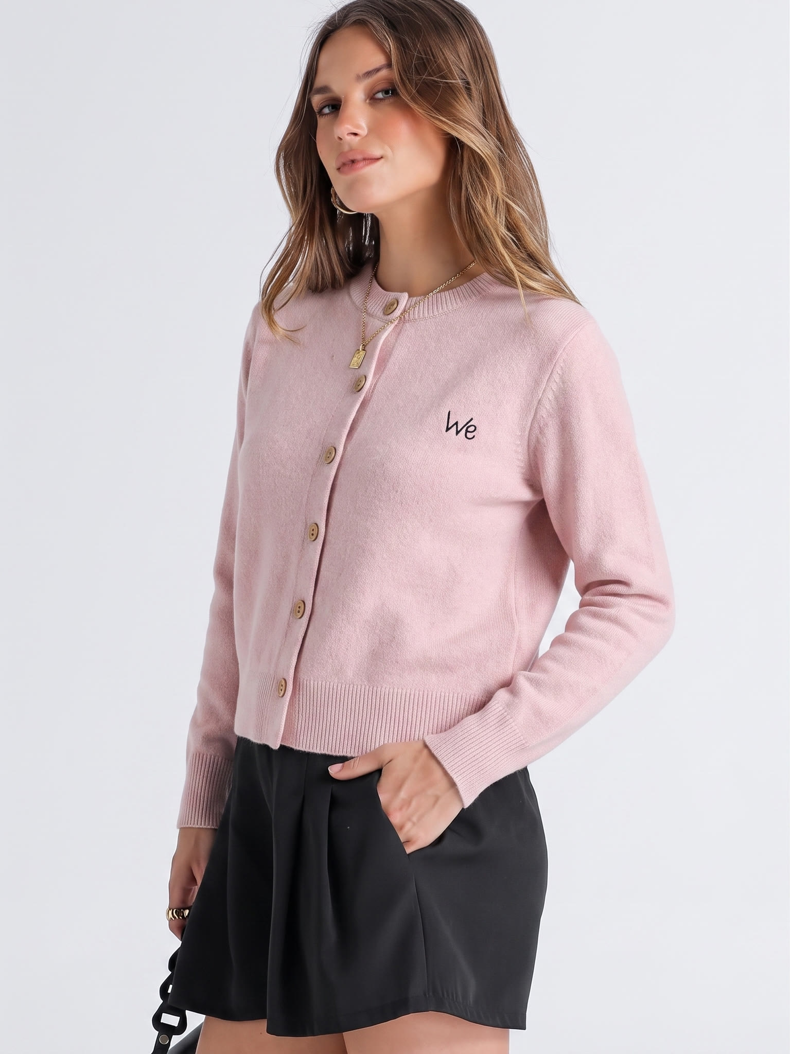 Three-quarter model view of the pink cardigan