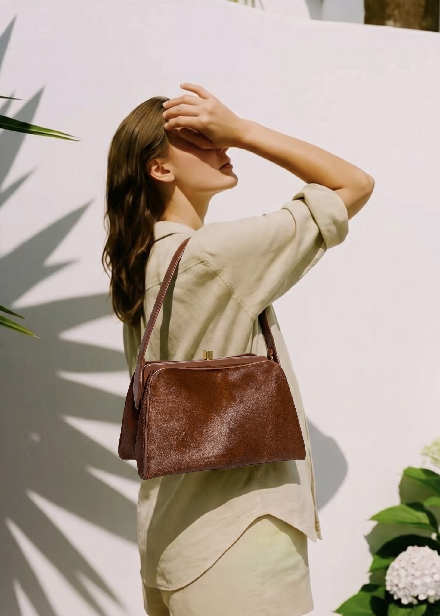 the same brown bag rendered on the shoulder of a generated model in a lifestyle scene, no model or photoshoot