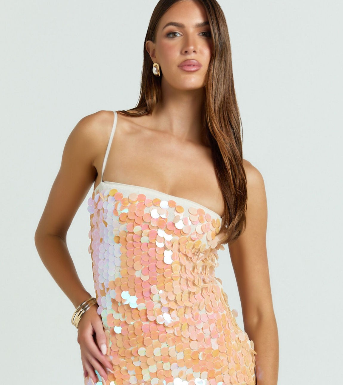 Apparel before AI recolor — original iridescent sequin dress on-model under even studio lighting