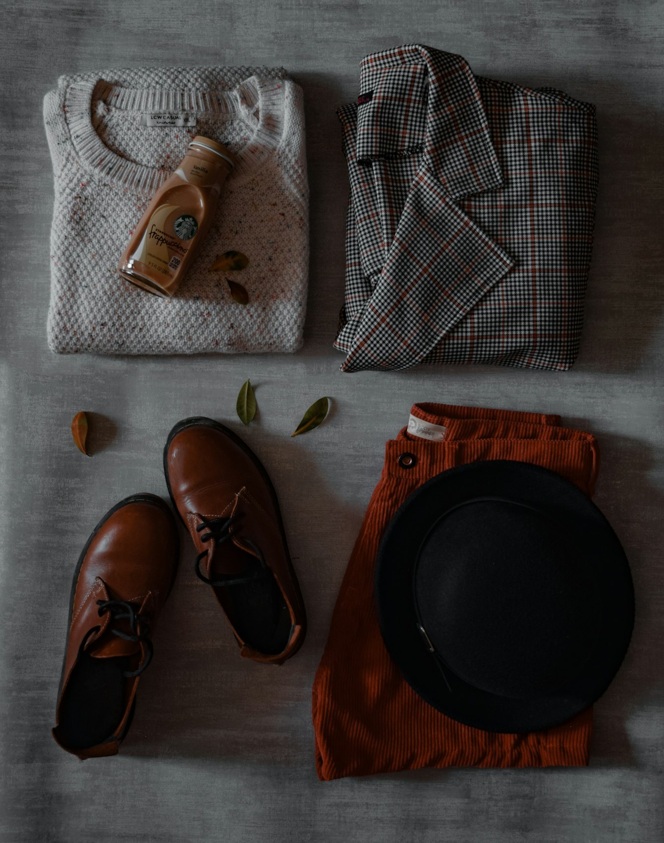 Flat lay clothing photography — a garment and accessories arranged and lit evenly from above