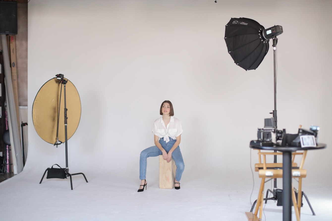 A clean on-model clothing photoshoot — a model wearing a tee and denim, the product-detail-page standard