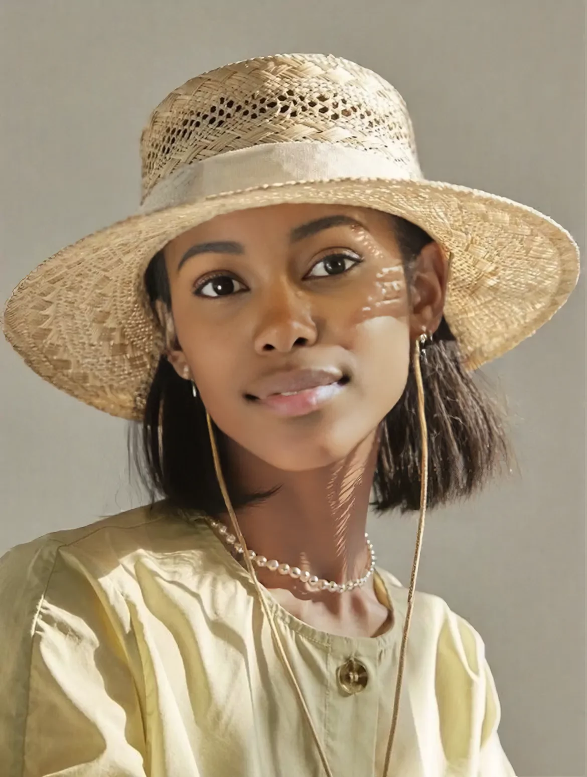 onmodel result on the straw hat portrait using the roshini preset model with smeared hat strings and necklace