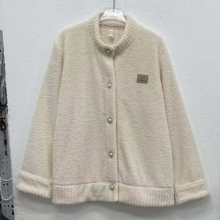 Full front hanger photo of a cream fleece jacket with five buttons and a chest patch