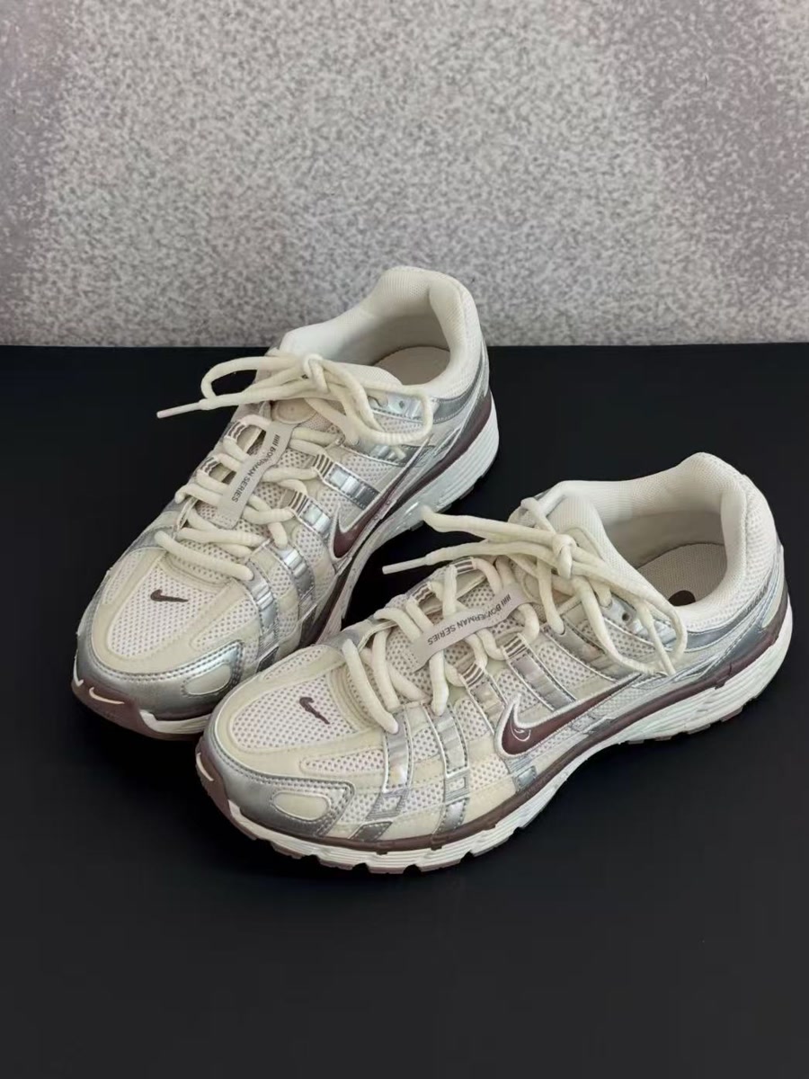 The source photo of the sneakers, shot on a grey and black surface