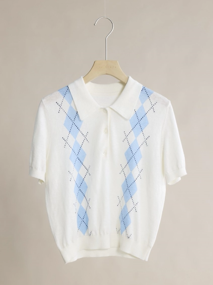 Original knit polo photographed on a hanger