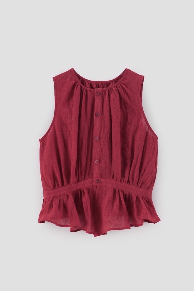 Same red top under purple-tinted lighting