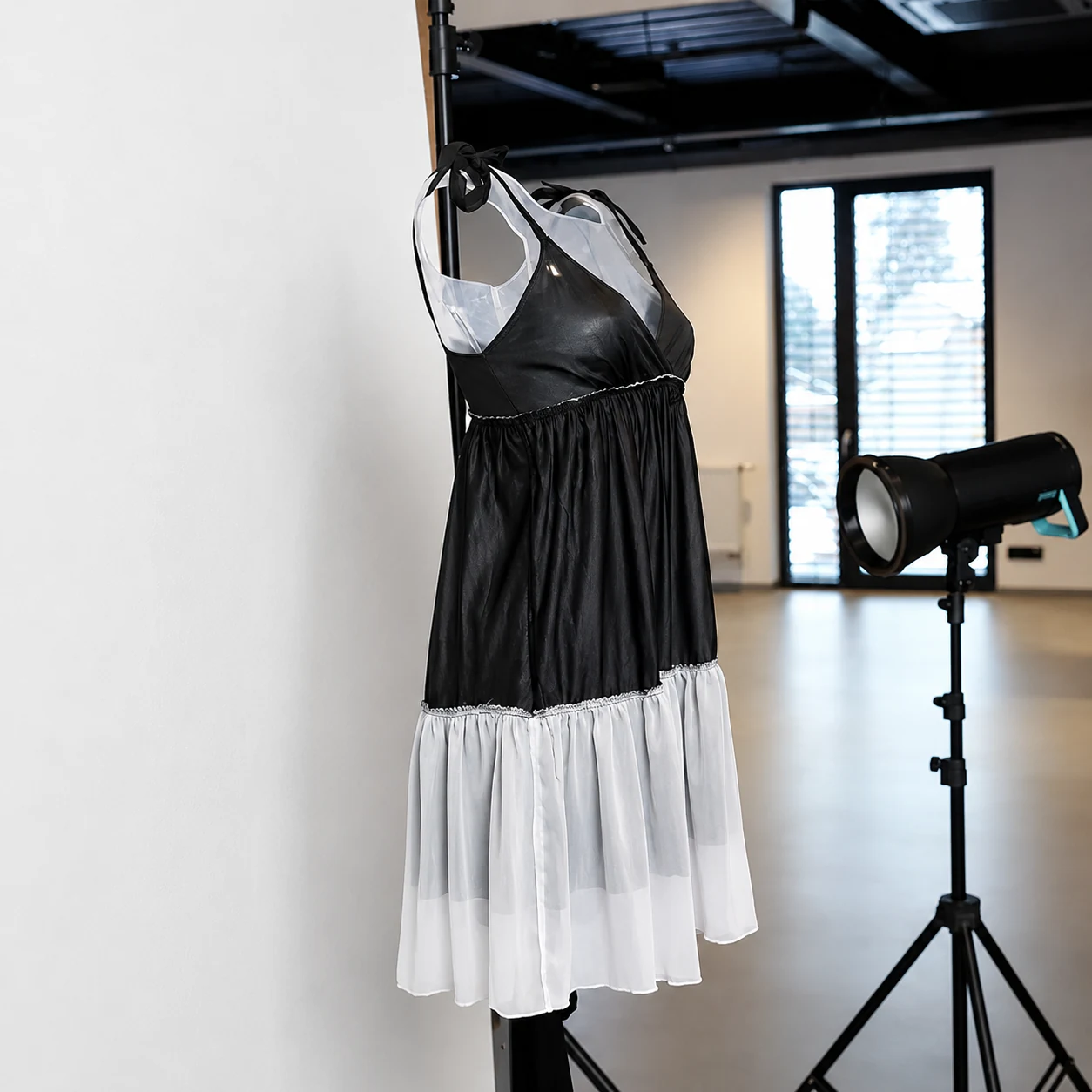 Traditional ghost mannequin photography setup with a dress supported on a mannequin and lit in a studio