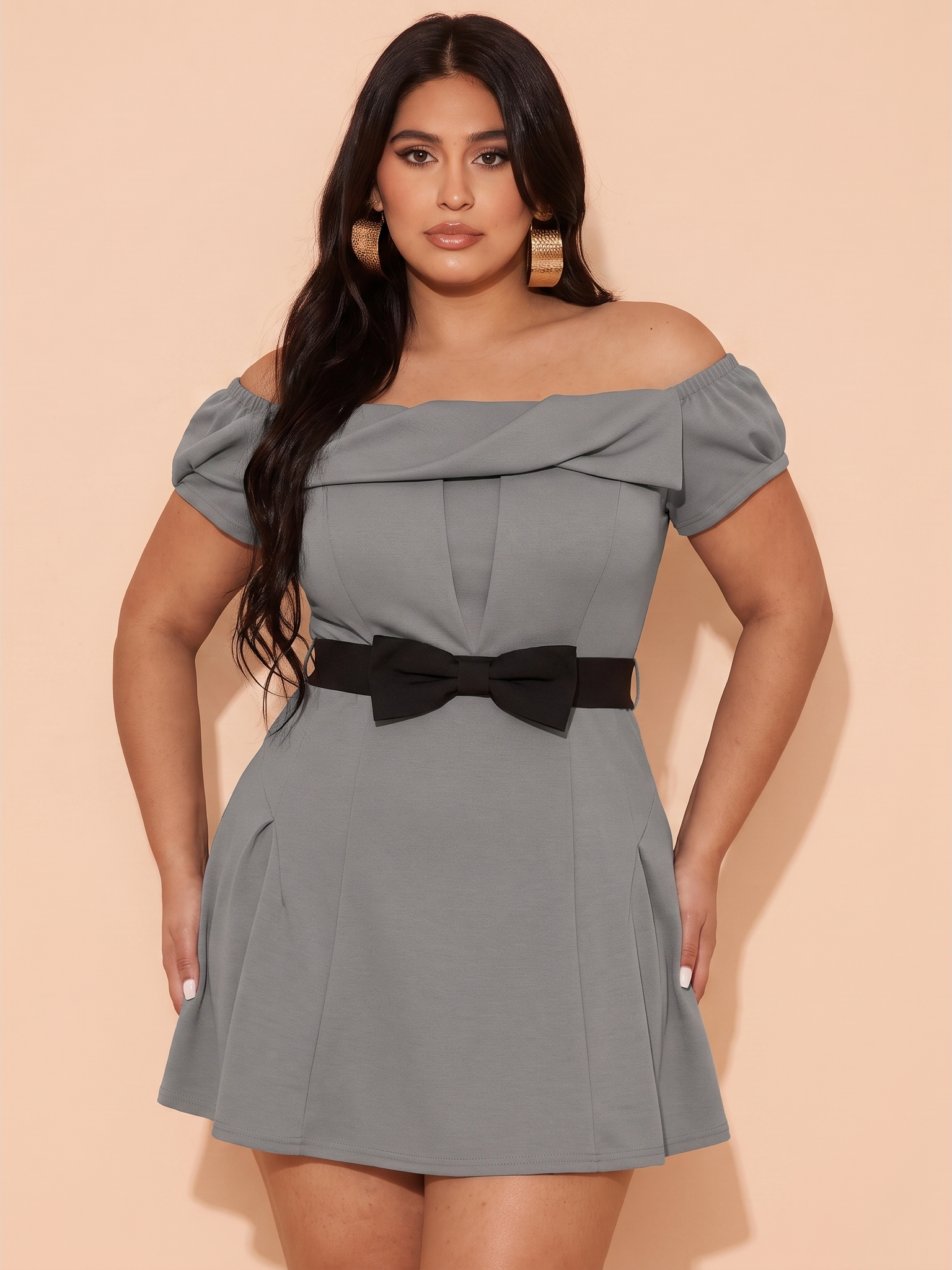 Plus-size model wearing the same gray dress