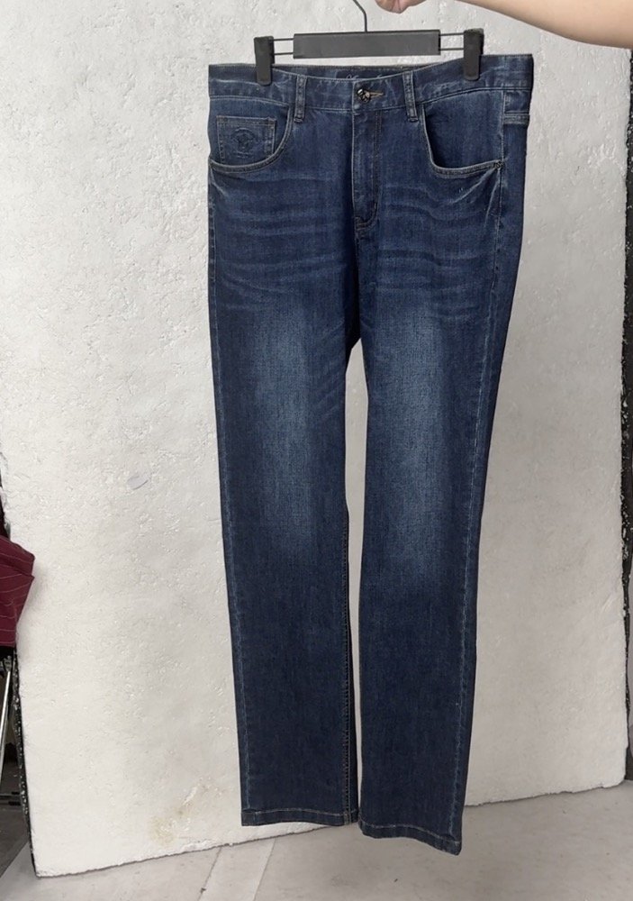 Flared denim jeans shown as a flat-lay product photo