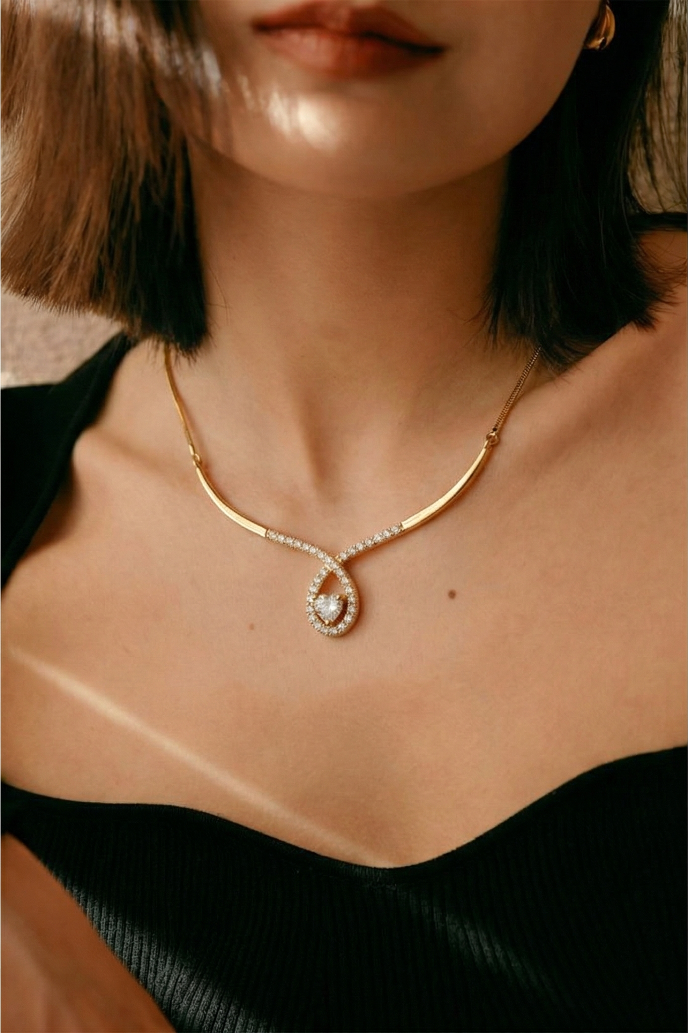 Jewelry on-model output from Snappyit Jewelry Model — same necklace rendered on a model template with correct chain drape and lighting