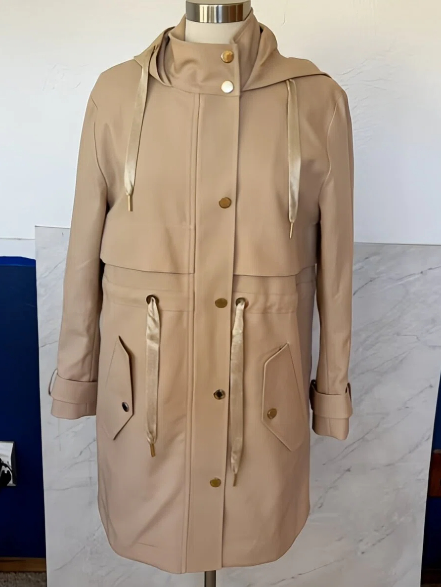 Tan parka coat on a dress-form mannequin — typical reseller phone source photo before AI Fashion Model