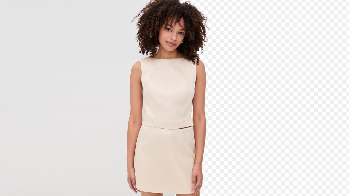 Snappyit cutting out an on-model clothing photo — original left, transparent right, hair edges kept soft