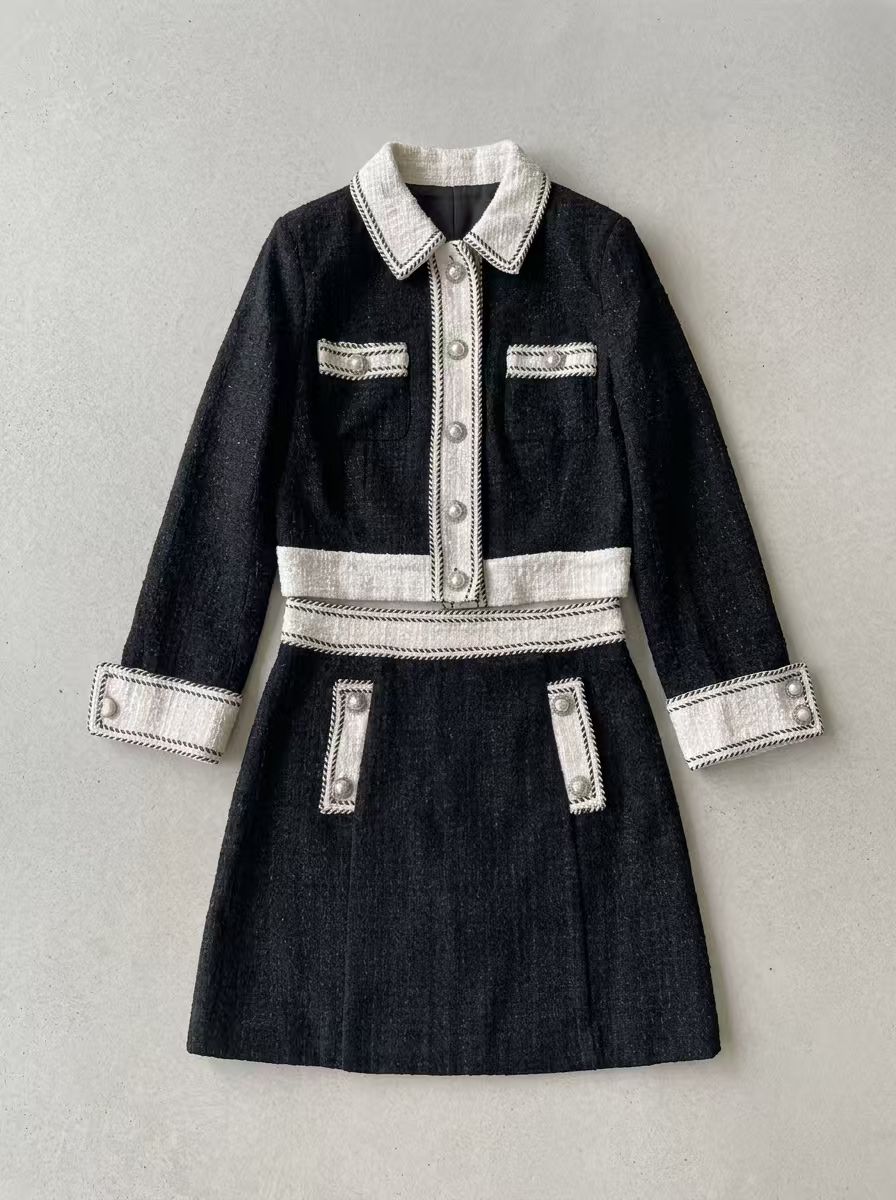 Pixelcut Flat Lay output: the tweed set rebuilt on a warm grey studio backdrop with the trim and pearl buttons retained