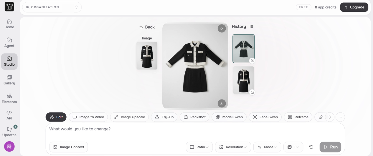 FASHN AI Studio workspace showing the generated flat lay and history, with the account name removed from the organization field
