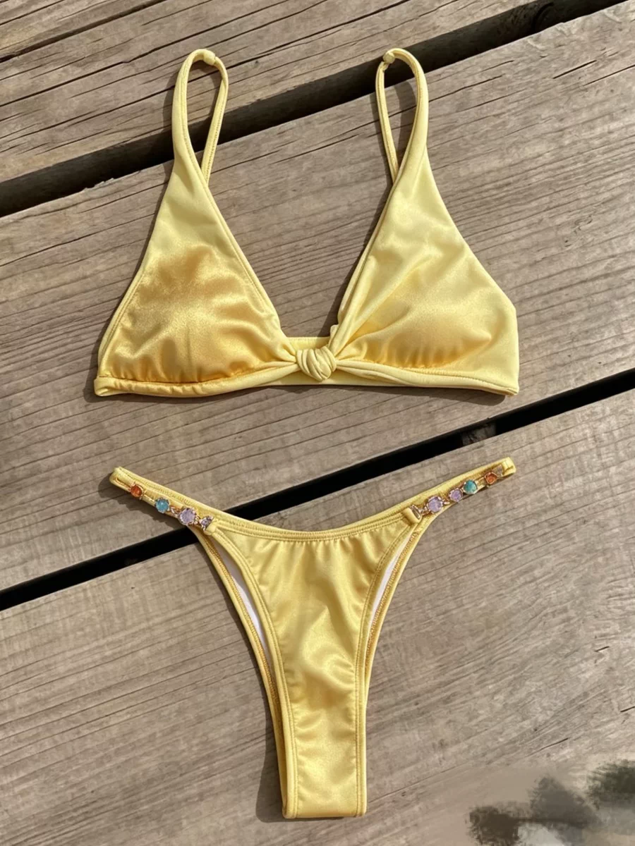 Yellow bikini photographed on a wooden deck before AI flat lay generation
