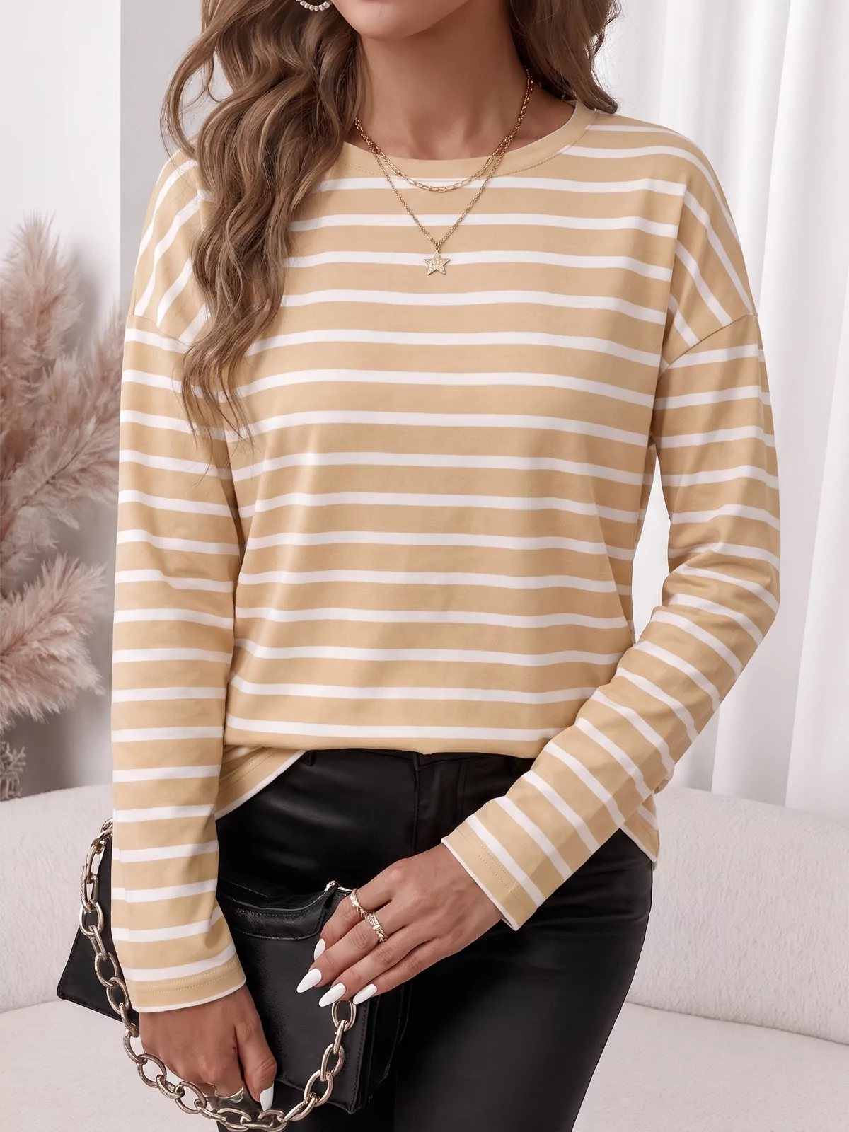 An AI fashion model wearing the beige striped top