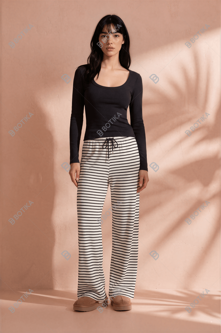 Botika AI model output — the black and white striped wide-leg pants rendered on a generated model