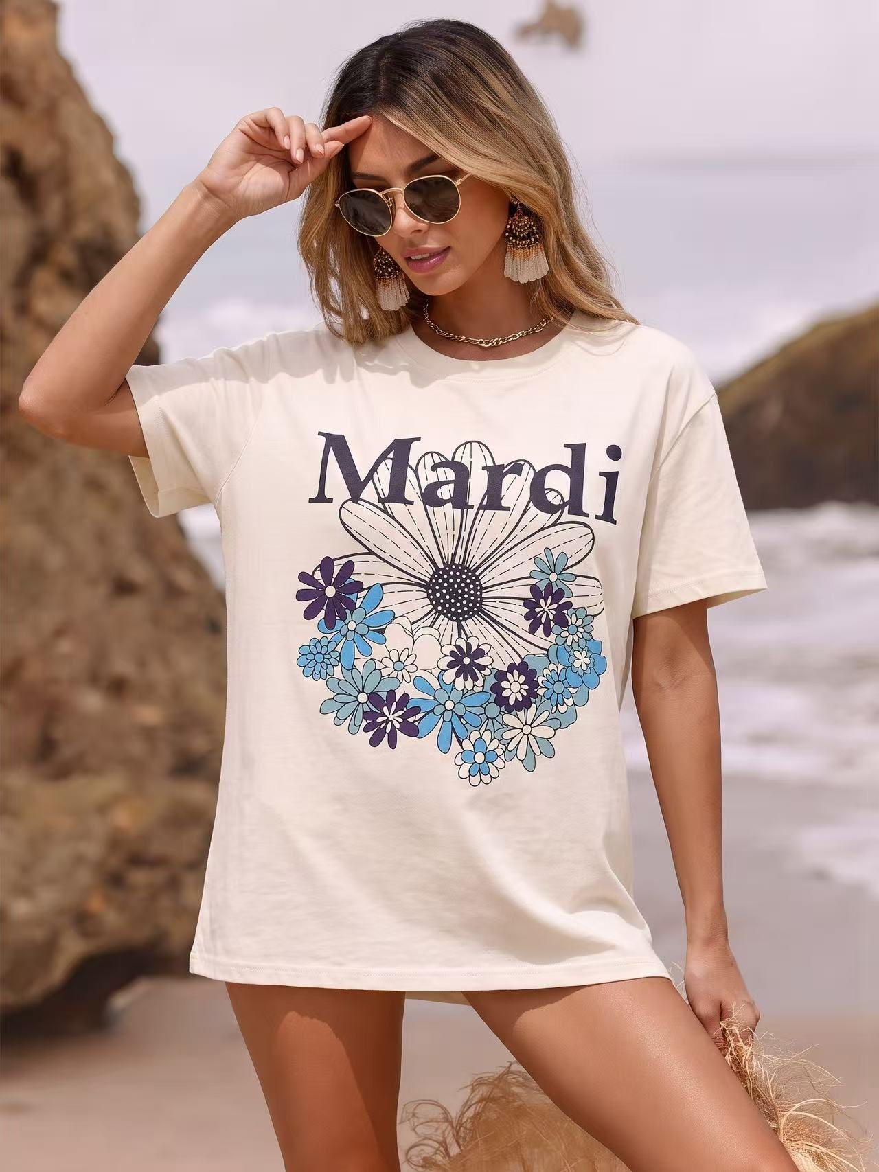Snappyit AI model output — the cream Mardi Mercredi graphic tee rendered on a generated model