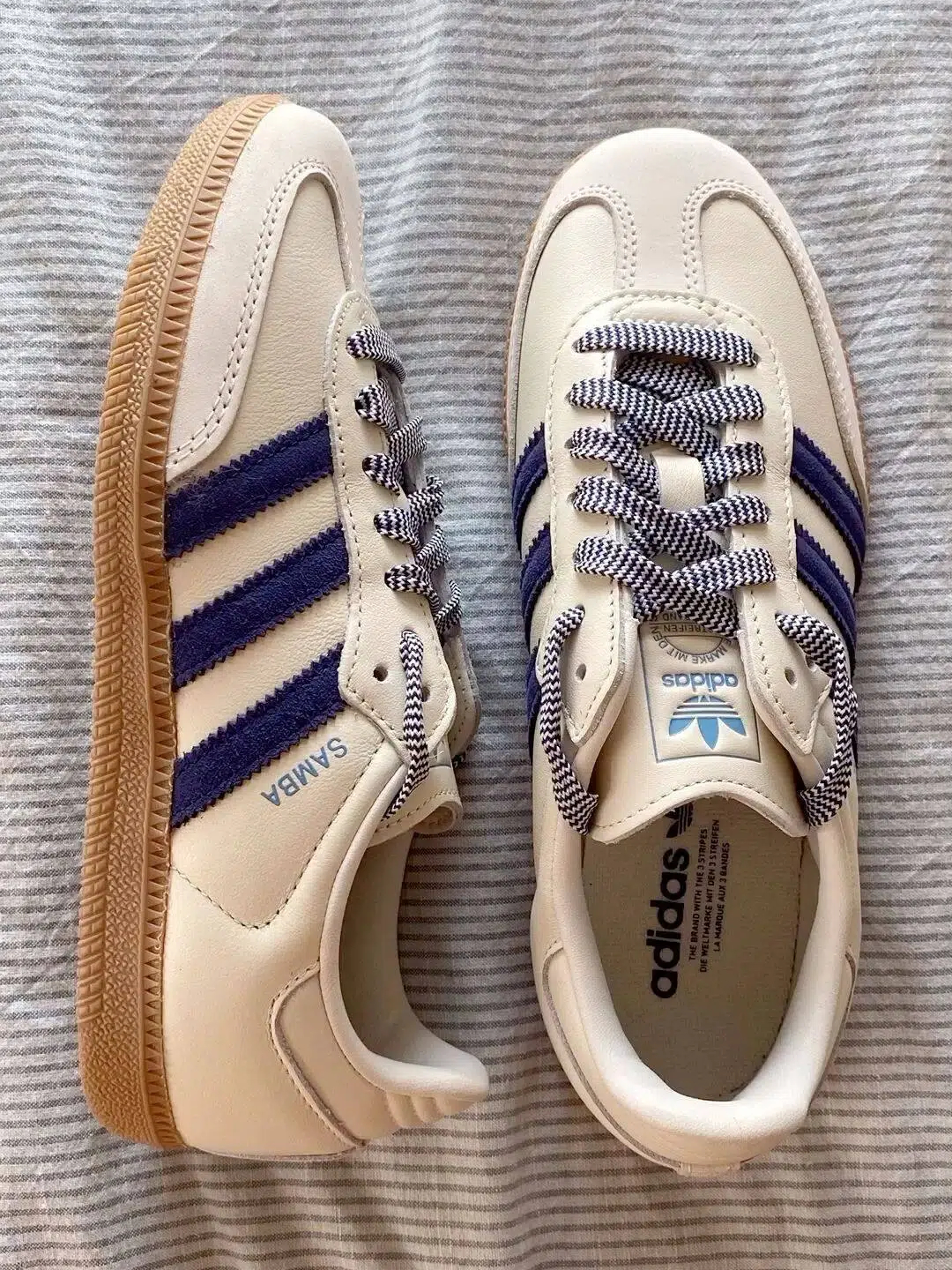 Cream sneakers photographed as a flat lay product image