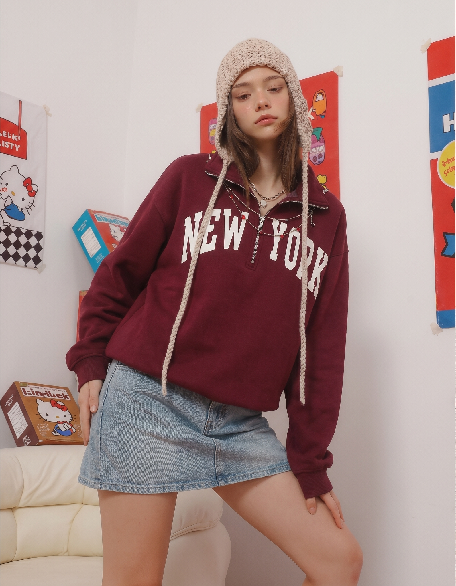 AI fashion-model render — same NEW YORK sweatshirt and denim skirt outfit on a model in a lifestyle interior, ready for Poshmark or eBay closet hero