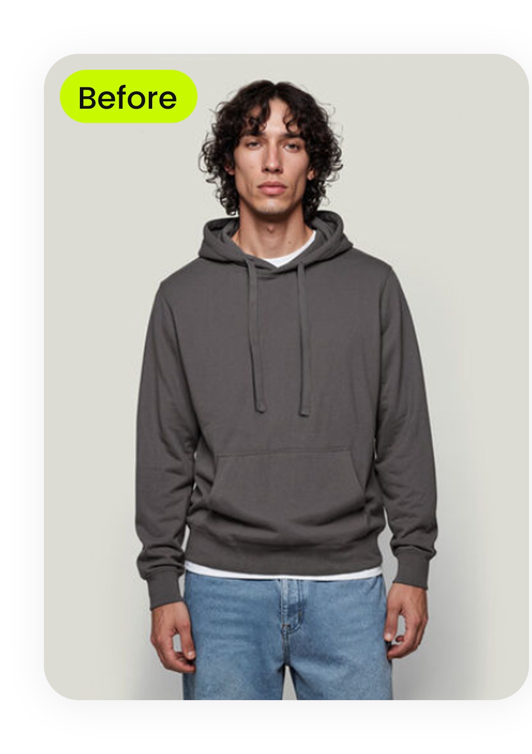Thrifted gray hoodie photographed on a person against a plain wall