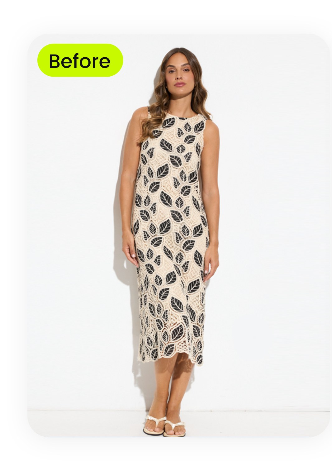 Vintage leaf-print sleeveless midi dress photographed on a young woman against a white wall